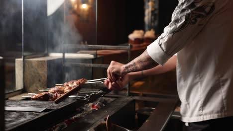 chef preparing grilled chicken skewers on a charcoal grill