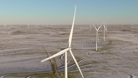 Aerial-shots-of-wind-turbines-on-a-cold-winter-afternoon-in-Calhan,-Colorado