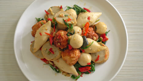 spicy stir fried fish balls with herbs