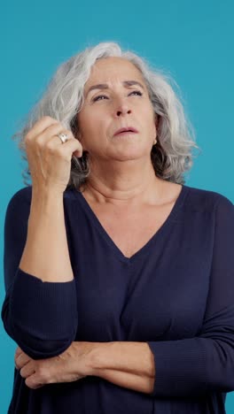 senior woman expressing thought, confusion, and frustration
