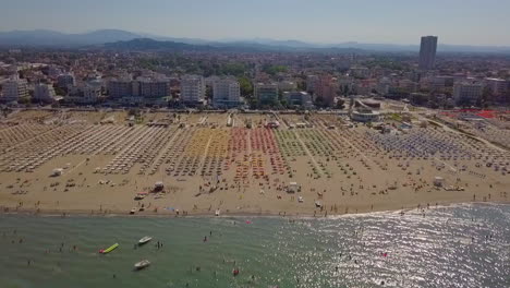 aerial view of rimini coastline at summertime in italy - drone sideways
