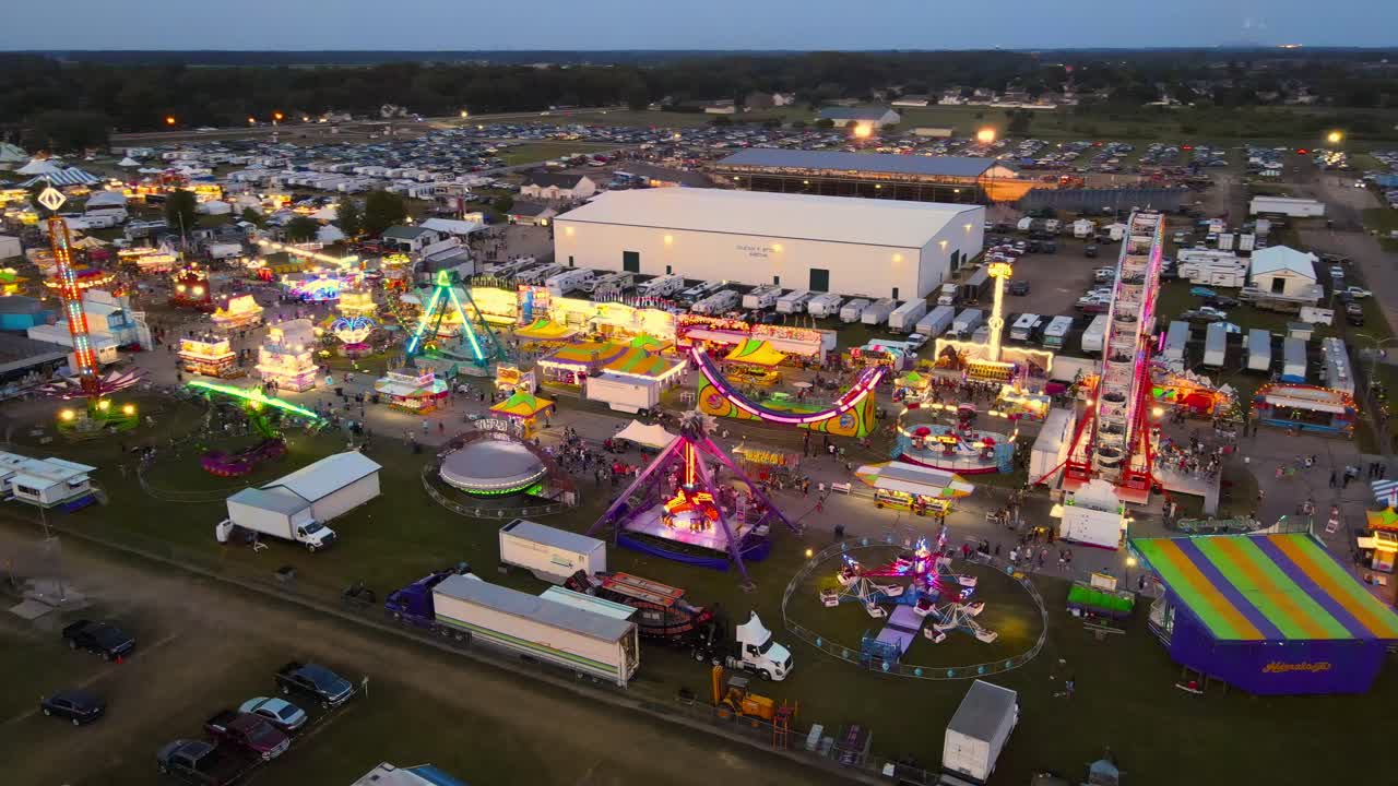 Carnival at the Monroe County Fairgrounds in aerial view from abov on colorful rides