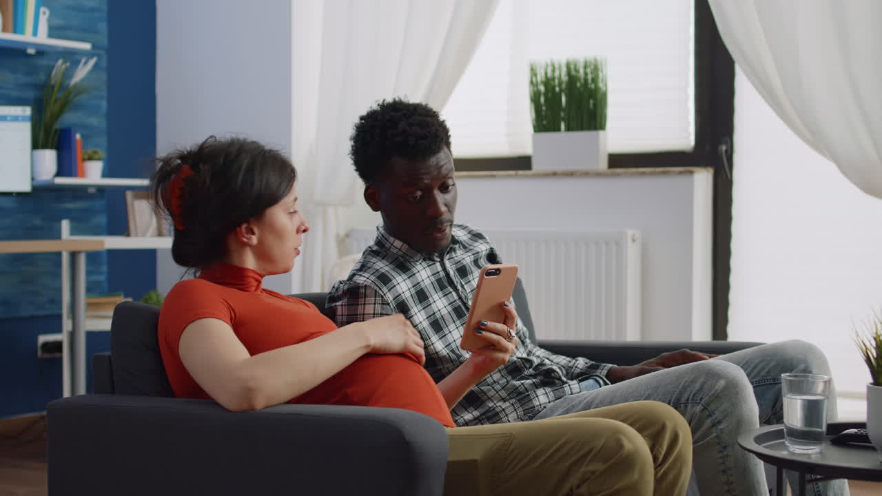 Modern interracial couple with pregnancy using technology