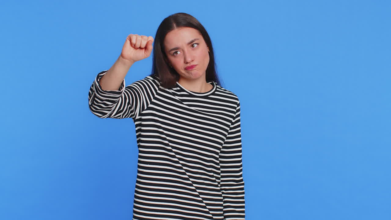 Confused caucasian woman knocking door gesture asking who is at home feeling embarrassed no idea