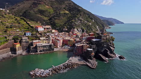 vernazza, cinque terre, italy, showcasing the vibrant coastal village with colorful buildings, clear blue water, and the natural beauty of the region