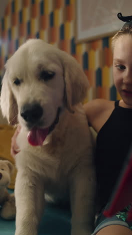 girl and puppy on couch