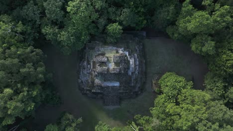 flying towards mayan pyramid at yaxha tikal national park, aerial