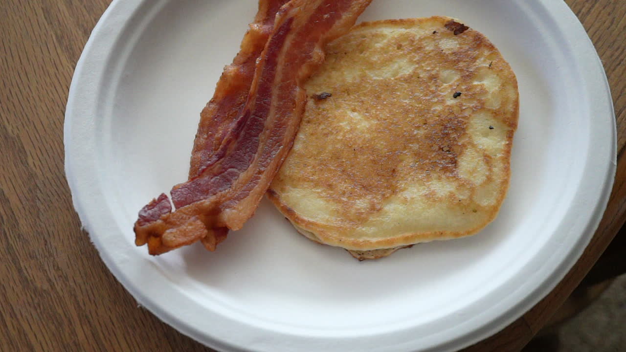 Fresh pancake and bacon breakfast to start the morning - top down view