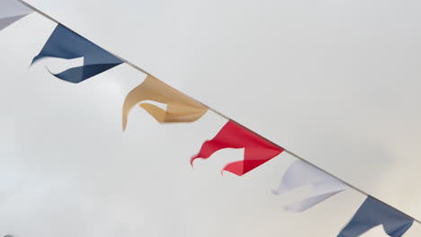 Colorful-flags-on-rope-in-cloudy-day