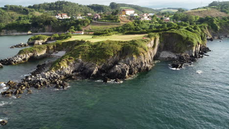 aerial view flying around a rocky coast