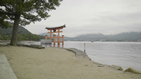 serene torii gate at miyajima island, japan