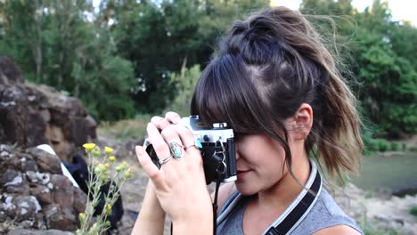 Handheld-footage-of-a-cute-hipster-girl-talking-and-messing-around-with-a-camera