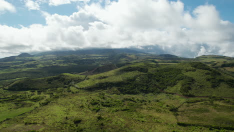 Aerial-shot-of-wild-nature-and-backlit-clouds-in-sky