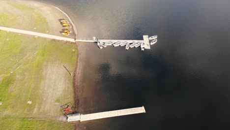 aerial shot of moored boats at wimbleball lake, somerset england on a sunny evening