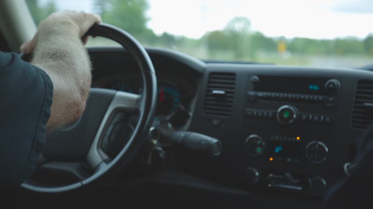 View Of A Car's Dashboard With A Man Driving - close up