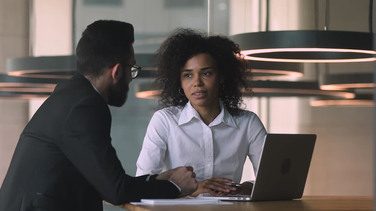 Female african manager broker advisor consulting arabic male client
