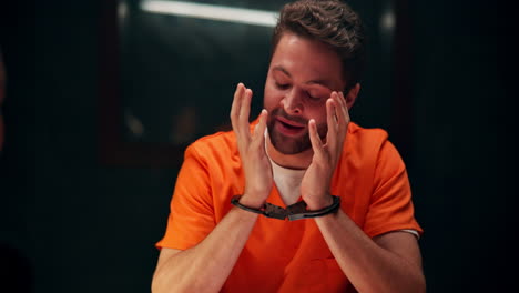 man in handcuffs during interrogation