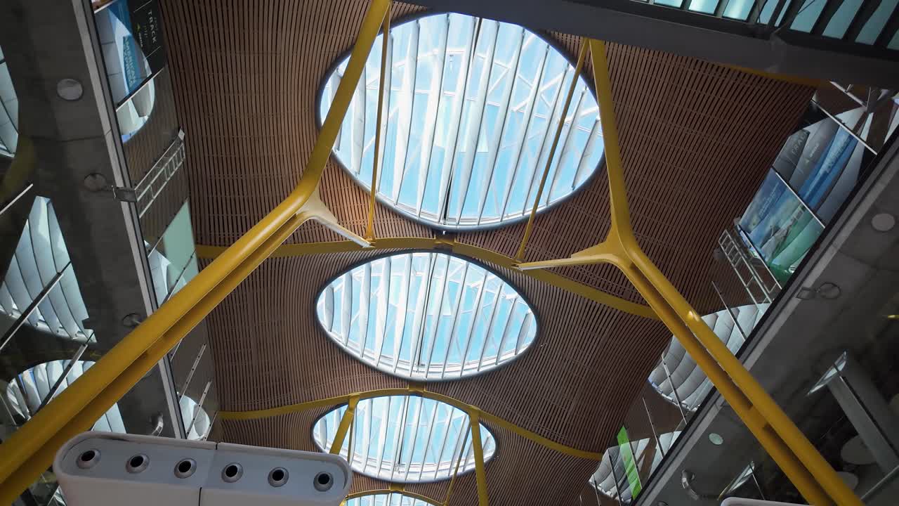 Panoramic shot of the interior of Adolfo Suárez Madrid-Barajas International Airport at midday