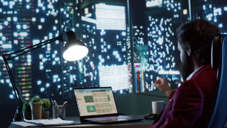 rich executive director admiring skyscraper view at night