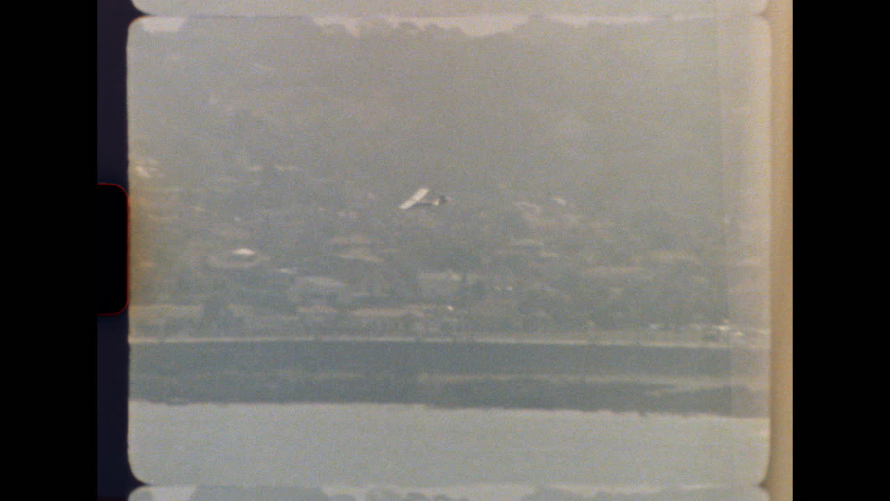 Aerial view of a landscape with an airplane