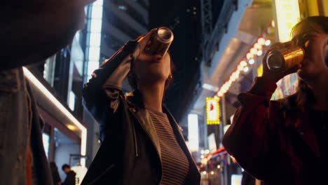 friends celebrating at night in a city