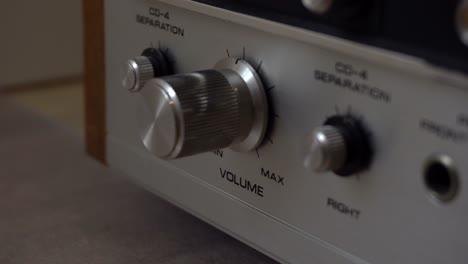 Pushing-buttons-and-twisting-knobs-on-an-old-amplifier