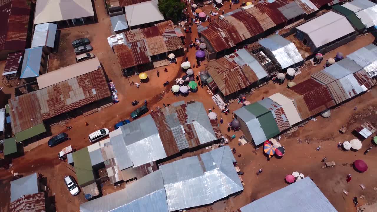 Drone top down view of colorful Karshi Town market and busy vibrant streets, 4K