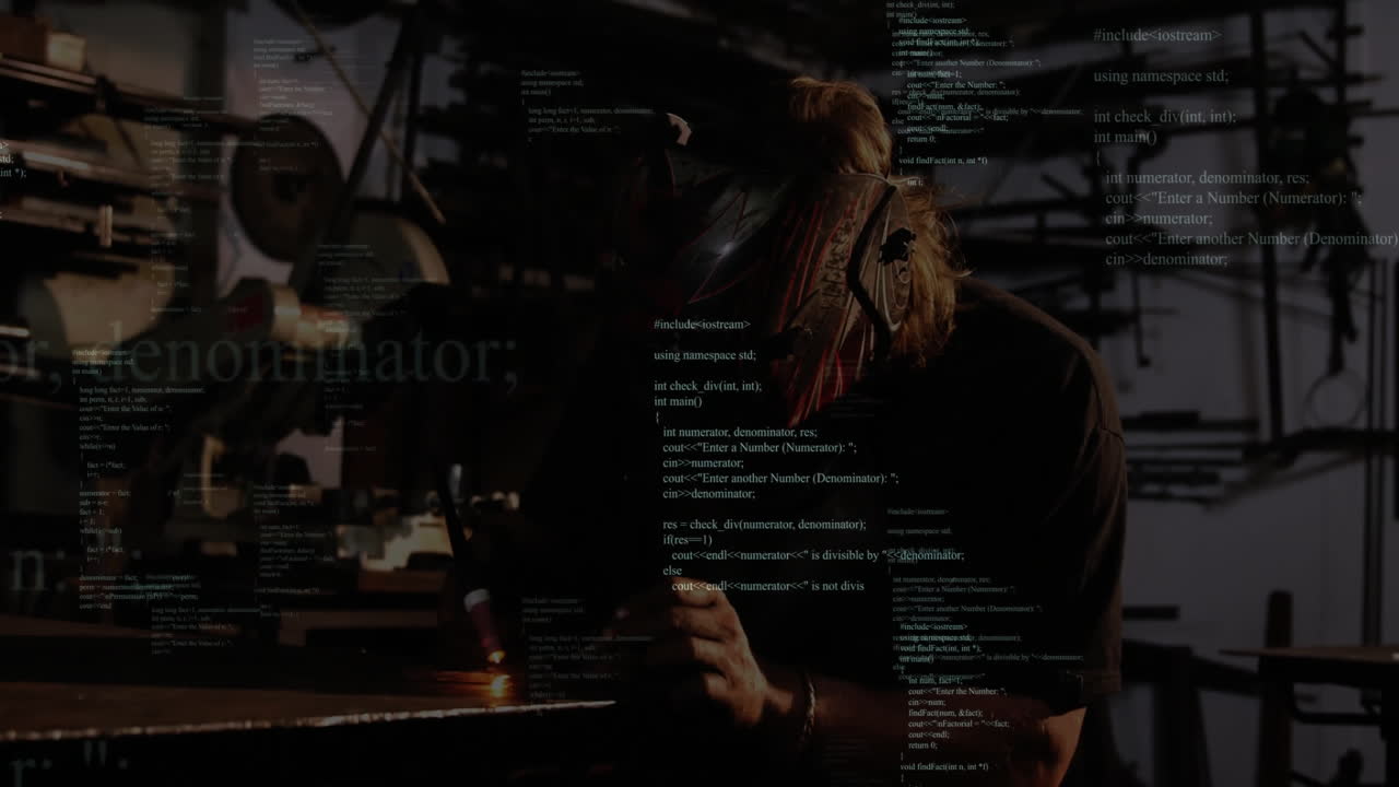 Welder bending over bench using welding torch in metal shop, with floating C++ code overlays
