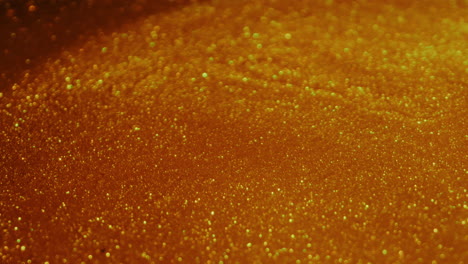 glittering molten gold. close-up rotate shot