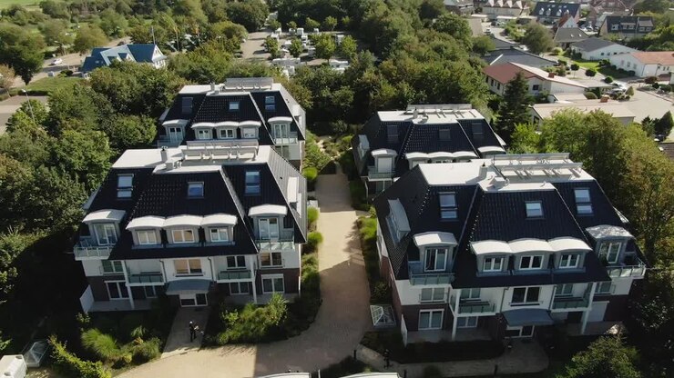 "Aerial view of 4 cozy vacation homes grouped together in Northern Germany