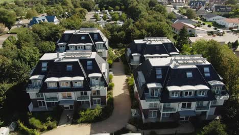 "Aerial-view-of-4-cozy-vacation-homes-grouped-together-in-Northern-Germany