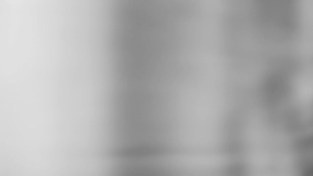 Animation of grey waving background in seamless motion with copy space