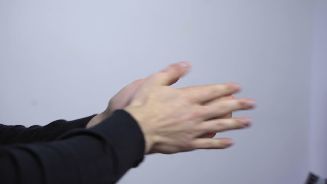 Two male hands rubbing together in anticipation, preparation, close up