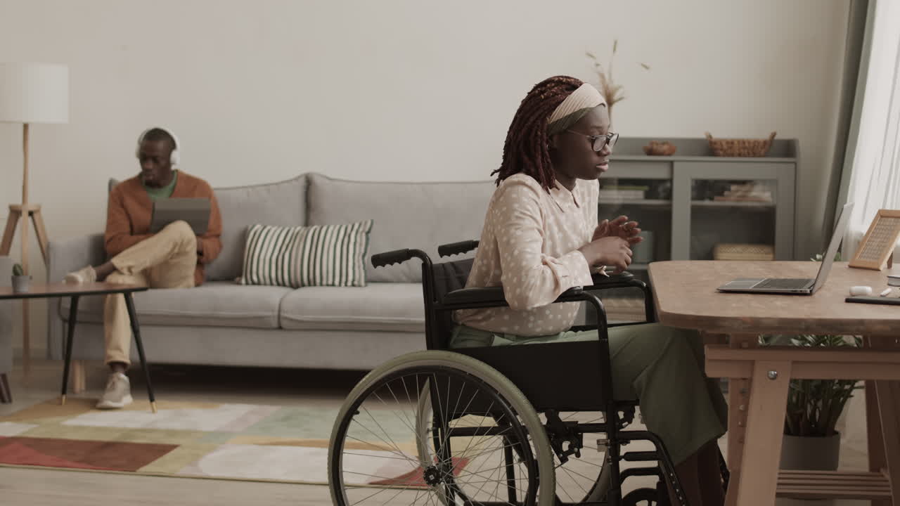 African-American Disabled Woman Working from Home