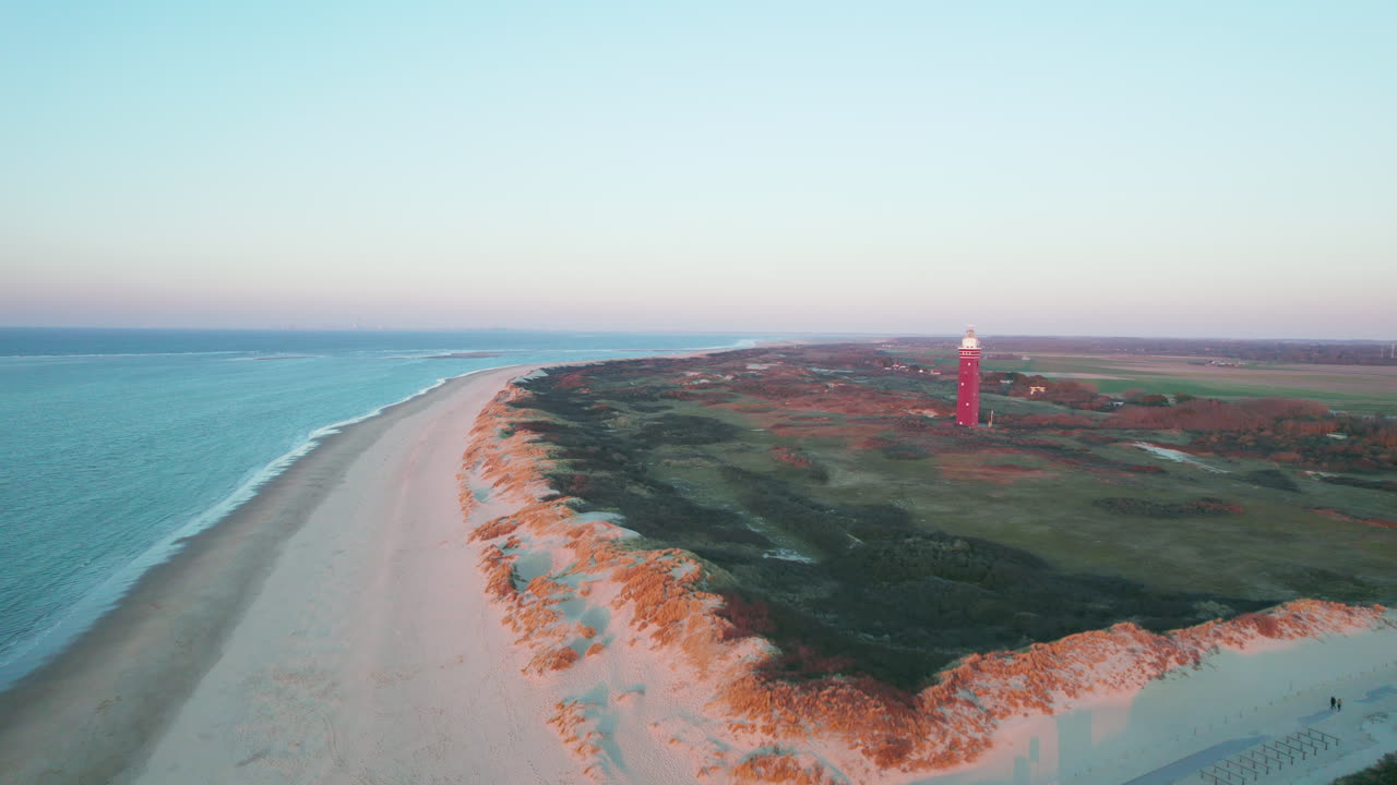 Westhoofd Lighthouse On Dune Grass Landscape In Ouddorp, South Holland, Netherlands