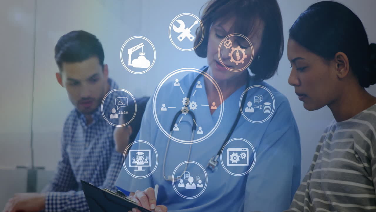 Animation of business icons over caucasian female doctor talking with her patient