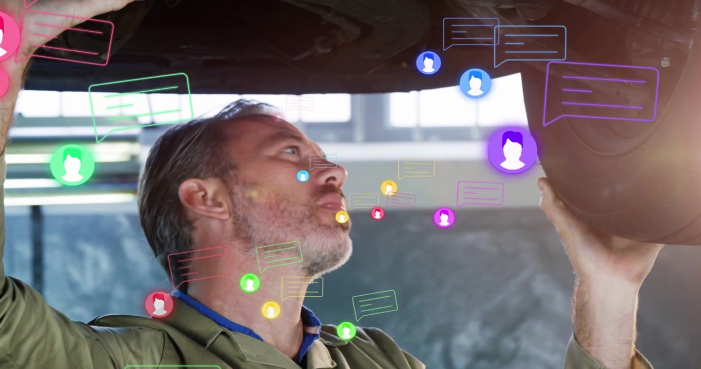 Vertical video: Lifted vehicle causing tech inspecting underbody while icons clustering around part