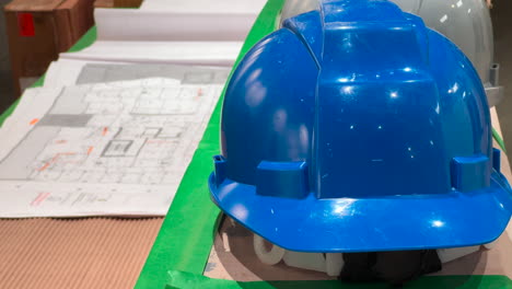 construction industry hard hat and building plans