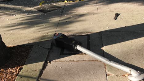 damaged parking meter after crash