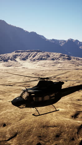 helicopter flying over a desert