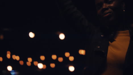 portrait beautiful african american woman holding sparkler celebrating new years eve on rooftop at night