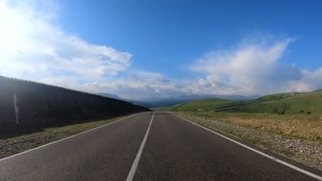 Point-of-View-Driving-a-Car-on-a-Road