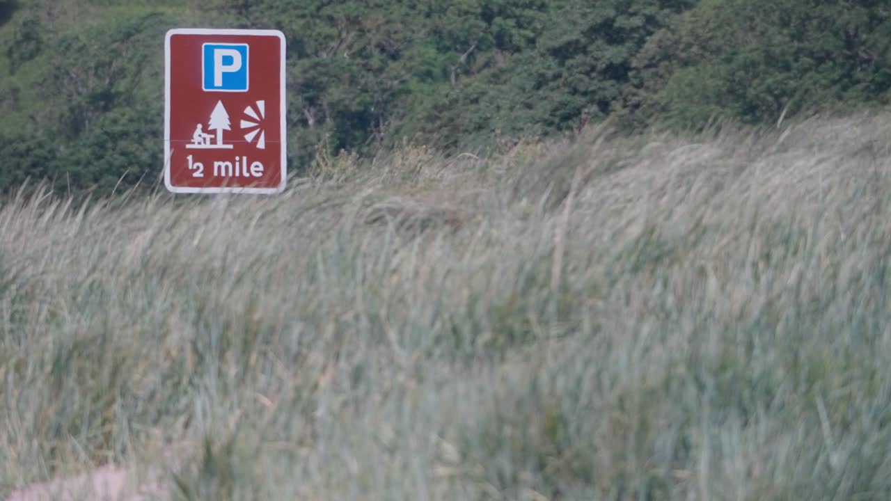 Roadside signage, picnic area graphics, transport infrastructure, slow-mo