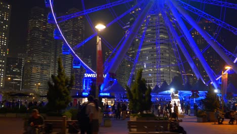 china night time illumination hong kong city famous ferris wheel crowded panorama 4k