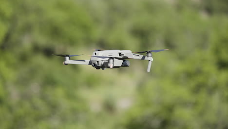 drone in flight over green trees