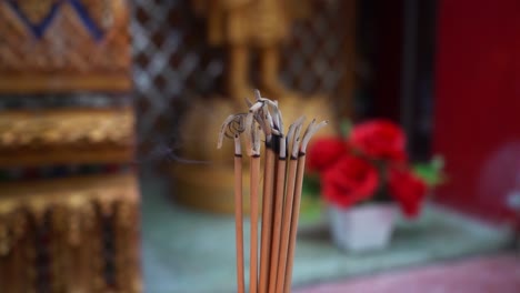 120 speed footage of burning incense at a temple for guiding meditation