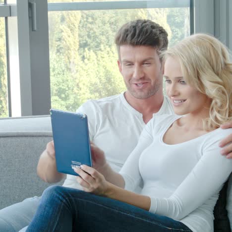 Happy-Couple-Using-Touch-Pad