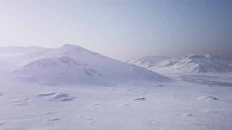 Aerial-Landscape-of-snowy-mountains-and-icy-shores-in-Antarctica