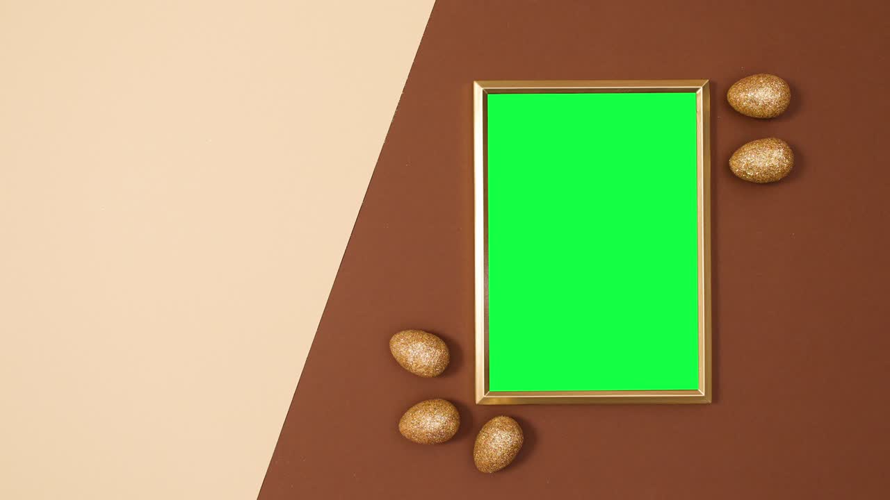 marco dorado con pantalla verde y glamour huevos de pascua de oro. dejar de moverse plana