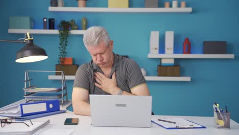 home office worker man is sick and coughing.